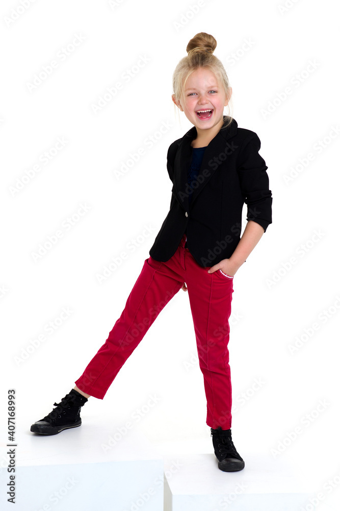 Stylish girl standing with hands on her waist Stylish girl standing with hands on her waist