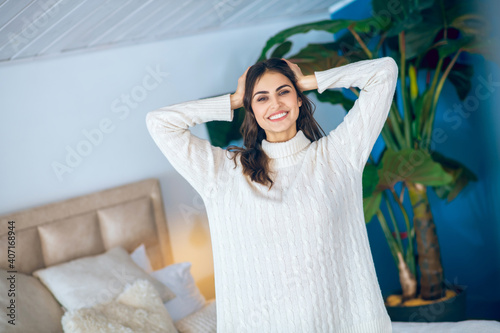 Dark-haired young woman feeling relaxed and sleepy