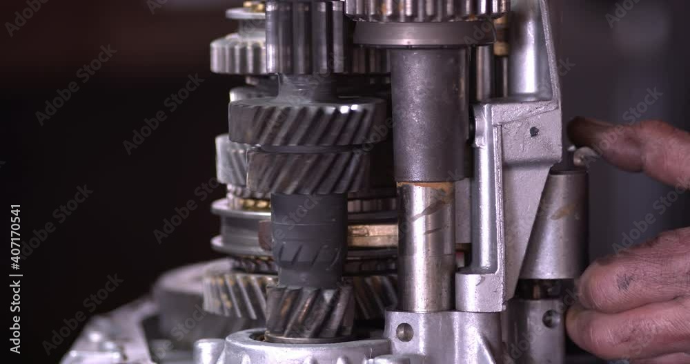 Car Repair Mechanic Controls Transmission Gears Manually Footage.