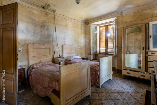 Italy, January 20, 2021. Bedroom in an abandoned country villa