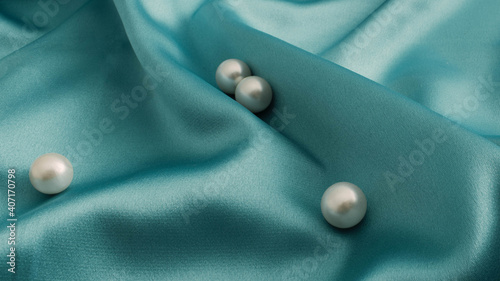 Pearls on tidewater green fabric. Romance
