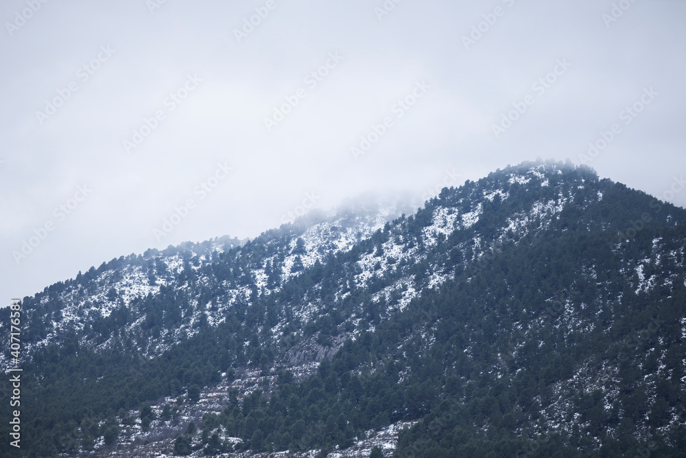 mountains with snow and fog