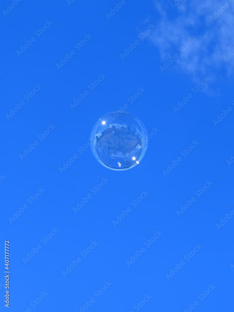 Beautiful soap bubble flies into the blue sky Beautiful soap bubble flies into the blue sky