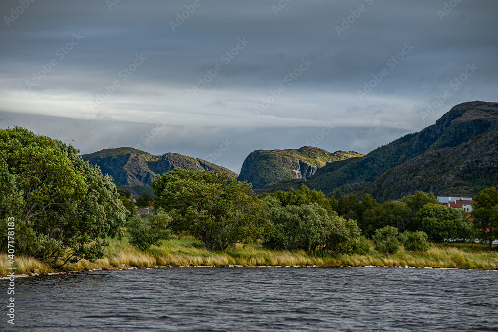 Lake surrounded by trees in morning in Norway Lake surrounded by trees in morning in Norway