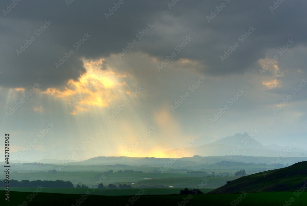 SUNBEAMS, CLOUDS AND MOUNTAINS.  Sunset in the southern Drakensberg, Underberg, kwazulu Natal, South Africa