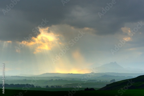 SUNBEAMS, CLOUDS AND MOUNTAINS. Sunset in the southern Drakensberg, Underberg, kwazulu Natal, South Africa
