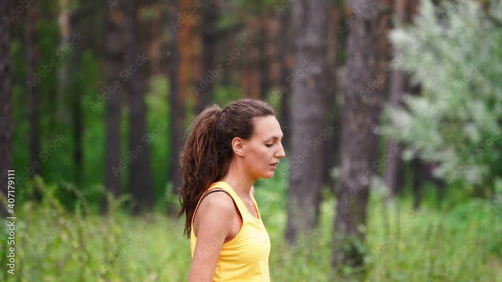 Woman warms up the muscles of the body before training Woman warms up the muscles of the body before training