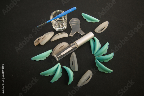 set of equipment for laminating eyelashes on a black background.	
