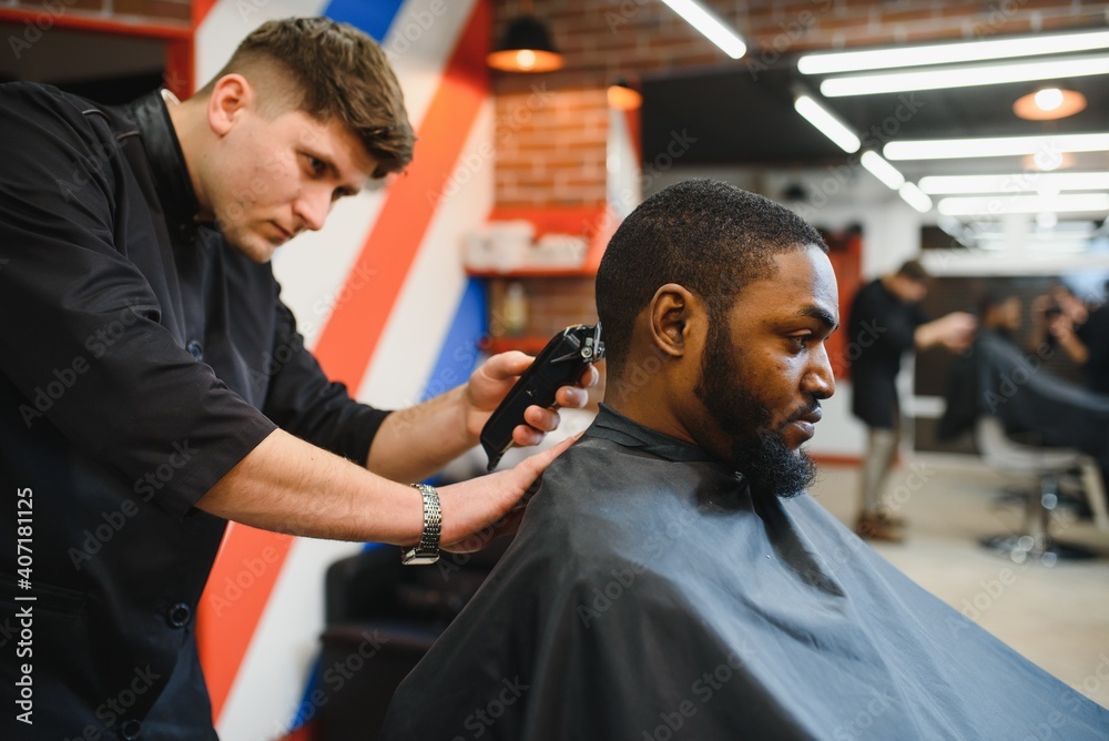 A Barber is Going through the Electric Cutting and Shaving Machine for the  Beard of an African-American Brazilian Boy Stock Image - Image of beauty,  business: 214303807