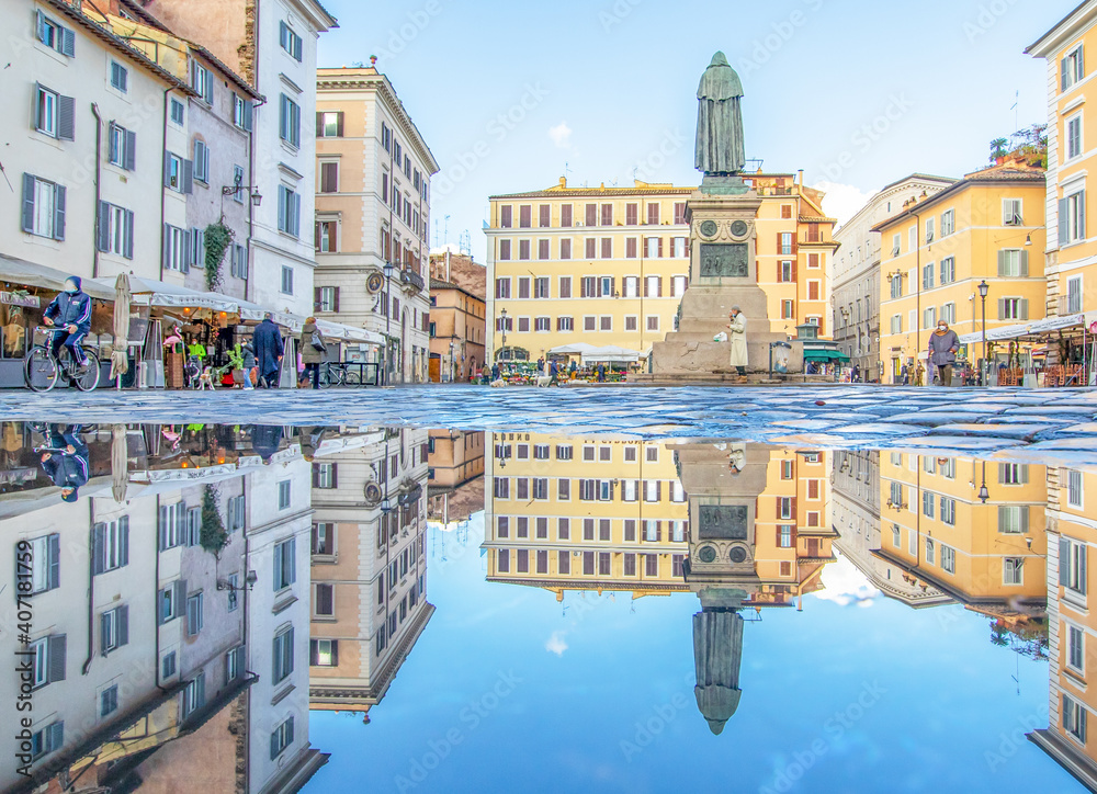 Rome, Italy - in Winter time, frequent rain showers create pools in which the wonderful Old Town of Rome reflect like in a mirror. Here in particular Campo de Fiori