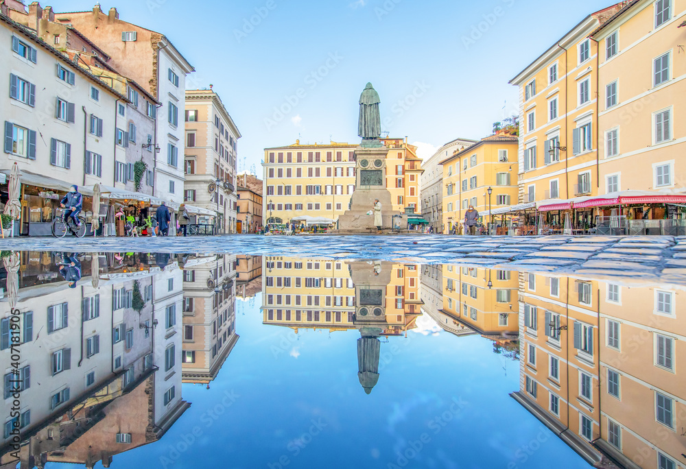 Rome, Italy - in Winter time, frequent rain showers create pools in which the wonderful Old Town of Rome reflect like in a mirror. Here in particular Campo de Fiori