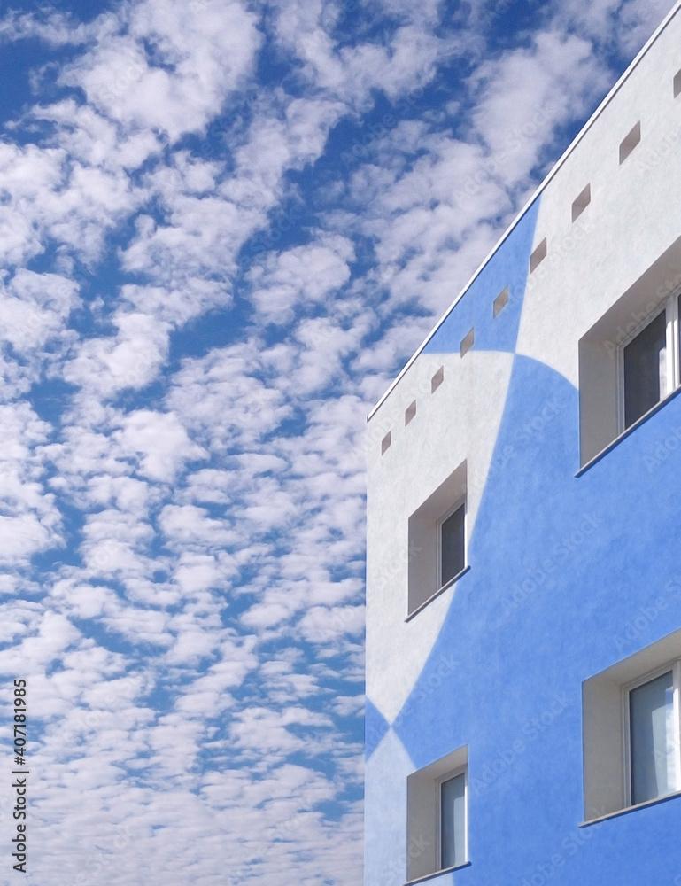 Blue and white facade of apartment building urban architecture real estate concept with copy space Blue and white facade of apartment building urban architecture real estate concept with copy space