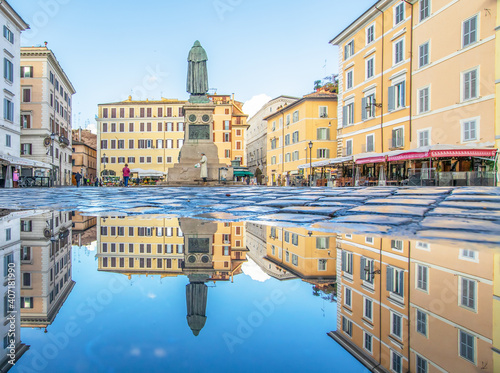 Rome, Italy - in Winter time, frequent rain showers create pools in which the wonderful Old Town of Rome reflect like in a mirror. Here in particular Campo de Fiori