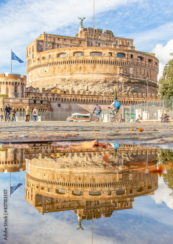 Rome, Italy - in Winter time, frequent rain showers create pools in which the wonderful Old Town of Rome reflect like in a mirror. Here in particular Castel Sant'Angelo