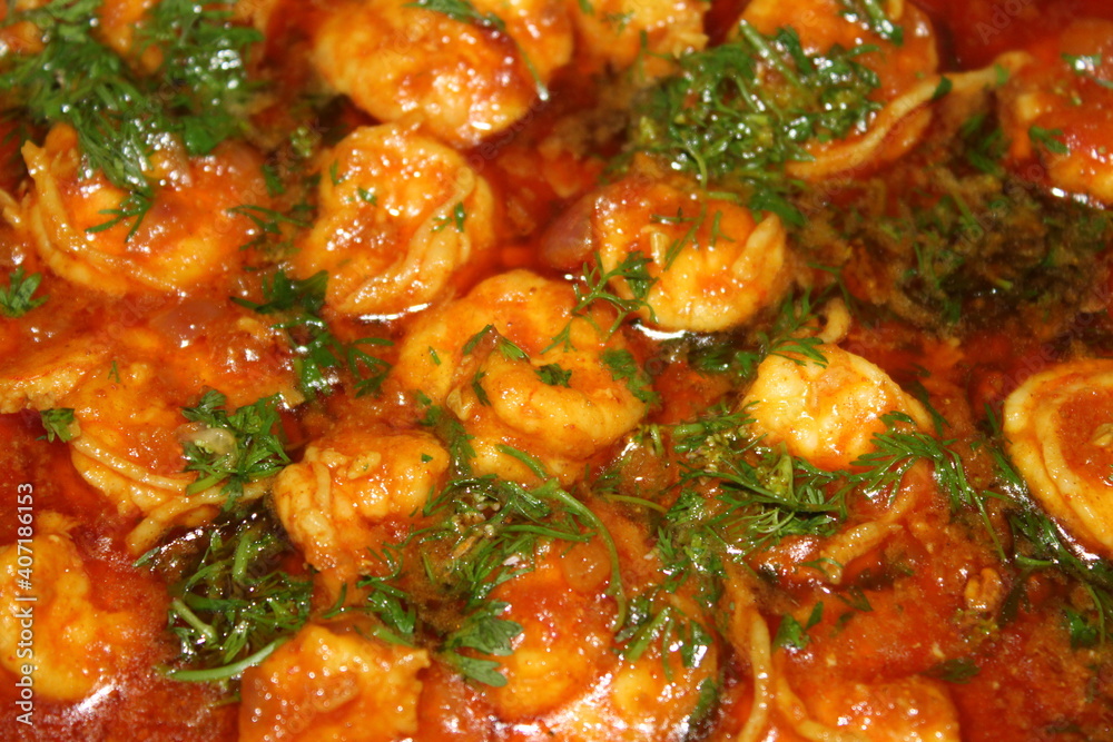 Spicy prawn curry garnished with coriander Spicy prawn curry garnished with coriander