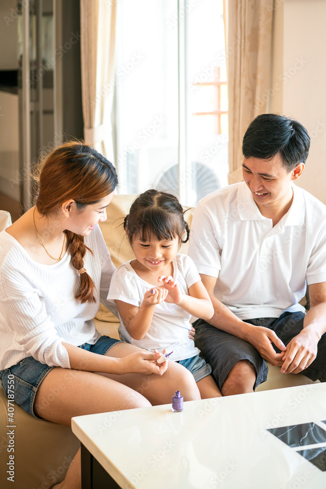 Asian mother spend happy family time together for paint her adorable daughter nail at home. Asian family and parenthood concept Asian mother spend happy family time together for paint her adorable daughter nail at home. Asian family and parenthood concept