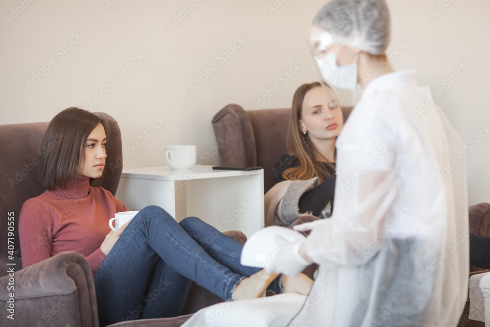 Obraz premium Woman making pedicure. Beauty procedure in salon.