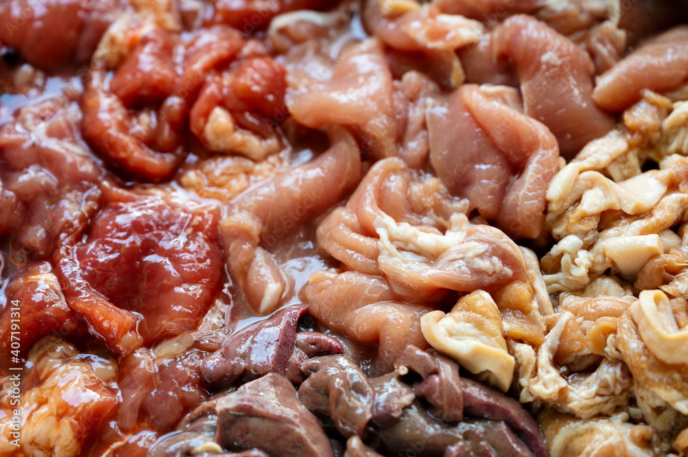 Various parts of raw sliced pork with marinated pork, pork belly, pork liver in stall Various parts of raw sliced pork with marinated pork, pork belly, pork liver in stall