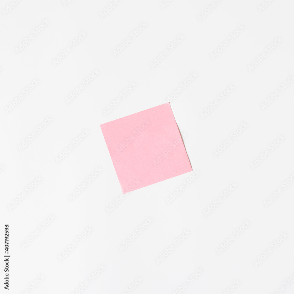 Pink sticker on a white wall, mock up. Blank sticky sheet, minimalism Pink sticker on a white wall, mock up. Blank sticky sheet, minimalism