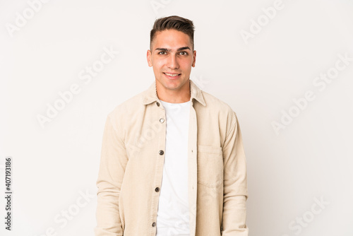 Young caucasian handsome man isolated happy, smiling and cheerful.