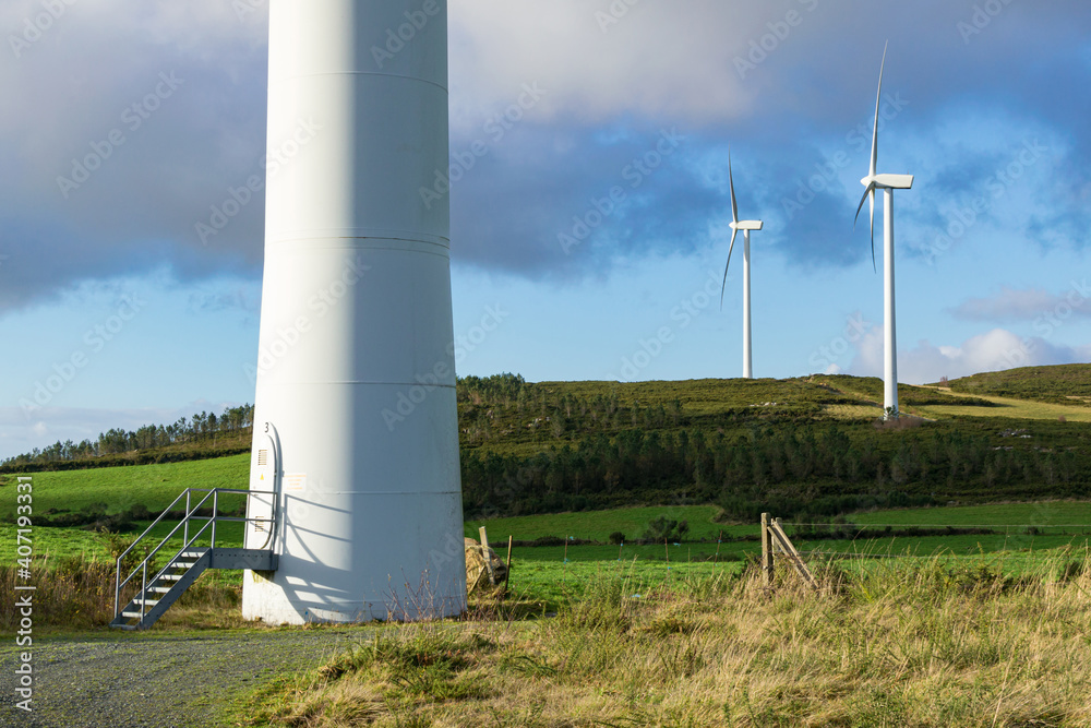 Partial view of a small wind farm on a Galician mountain a mill in the foreground and two others in the distance Partial view of a small wind farm on a Galician mountain a mill in the foreground and two others in the distance