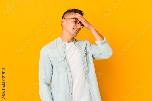 Young handsome caucasian man isolated laughing happy, carefree, natural emotion.