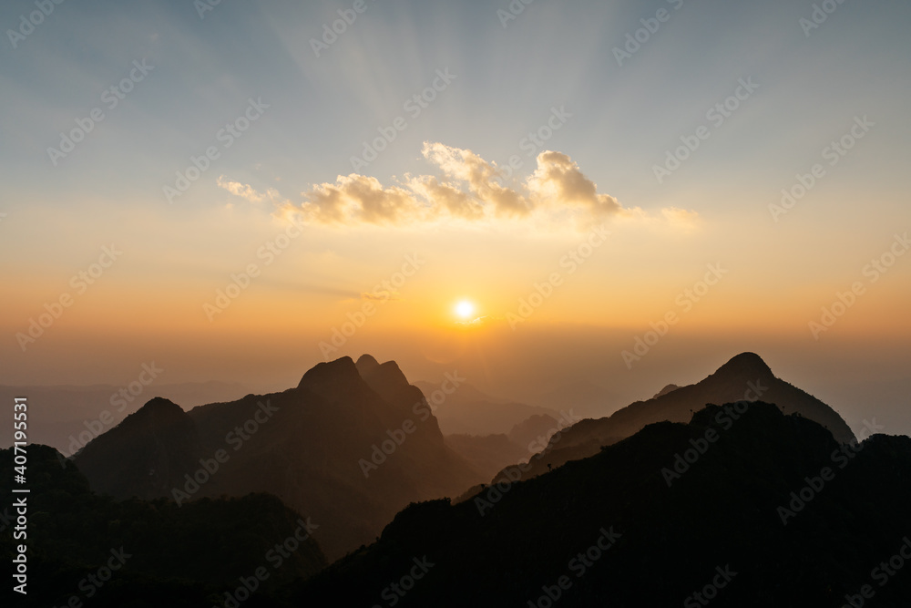 The landscape of Mountains, cloud with sunray and dusk near the sunset of Doi Luang, Chiang Dao, Chiang Mai, Thailand. Taking photo from the summit.