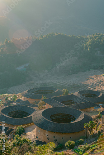 Sunset view of the Tulous, the historic buildings in Tianluokeng, Fujian province, China. photo