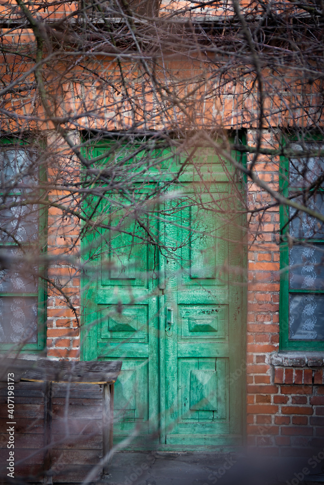 Fototapeta premium oldold wooden door in abandoned building