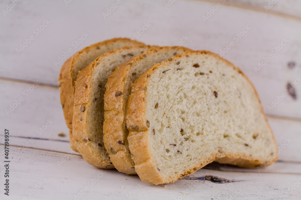 a sliced bread on a wooden table a sliced bread on a wooden table