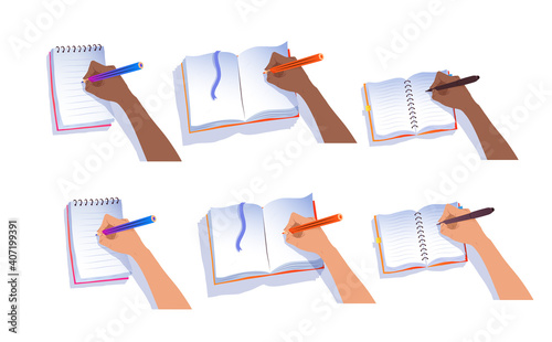 Hands writing in notebooks
