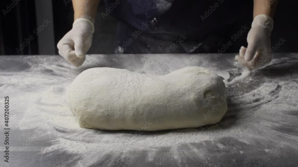 throw a large dough on the counter slow motion