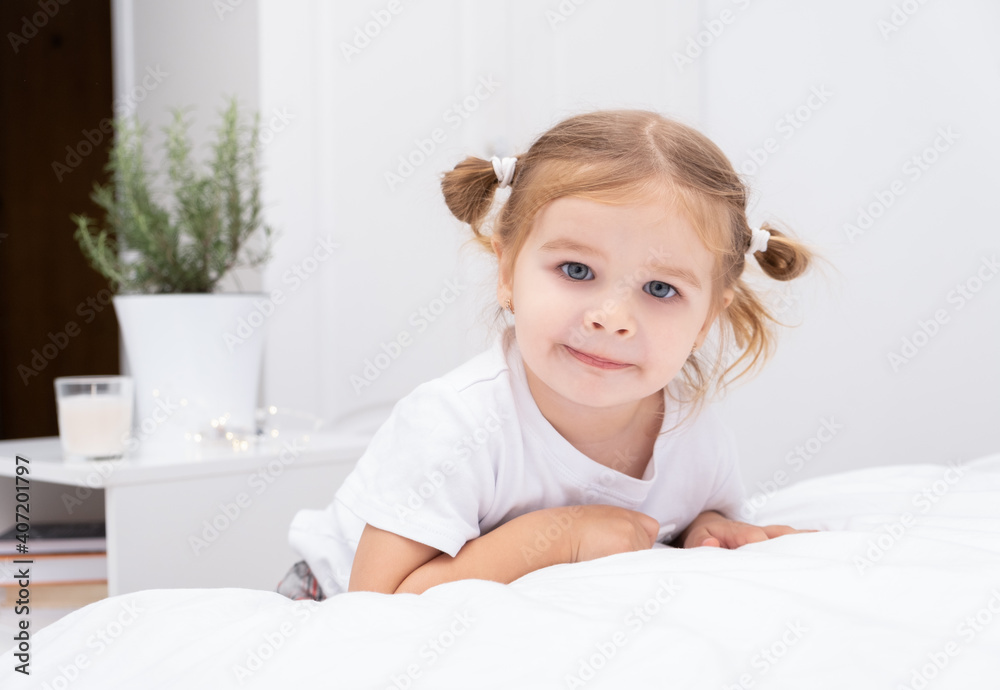 portrait of toddler blond girl with two tails at home portrait of toddler blond girl with two tails at home