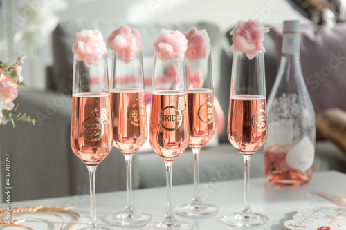 Champagne glasses
 covered with cotton candy in the style of the bride's bachelorette party.