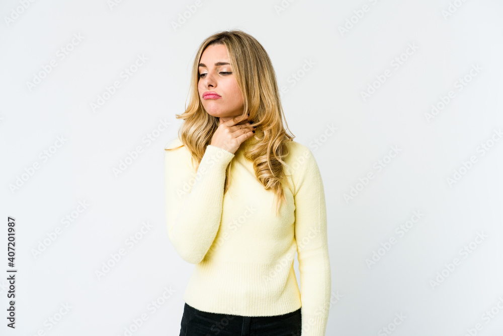 Young caucasian blonde woman suffers pain in throat due a virus or infection. Young caucasian blonde woman suffers pain in throat due a virus or infection.