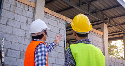 Team of engineers or inspectors is inspect the structural integrity and construction of the house before present to the client. Check the building concept