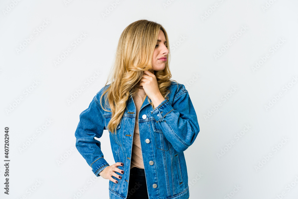 Young caucasian blonde woman suffers pain in throat due a virus or infection. Young caucasian blonde woman suffers pain in throat due a virus or infection.