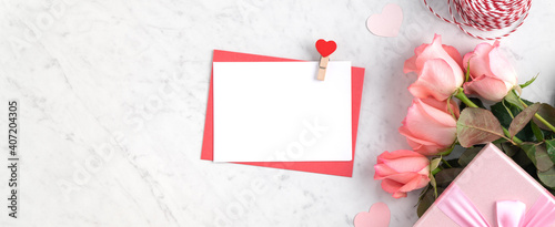 Valentine's Day design concept background with pink rose flower and gift box.