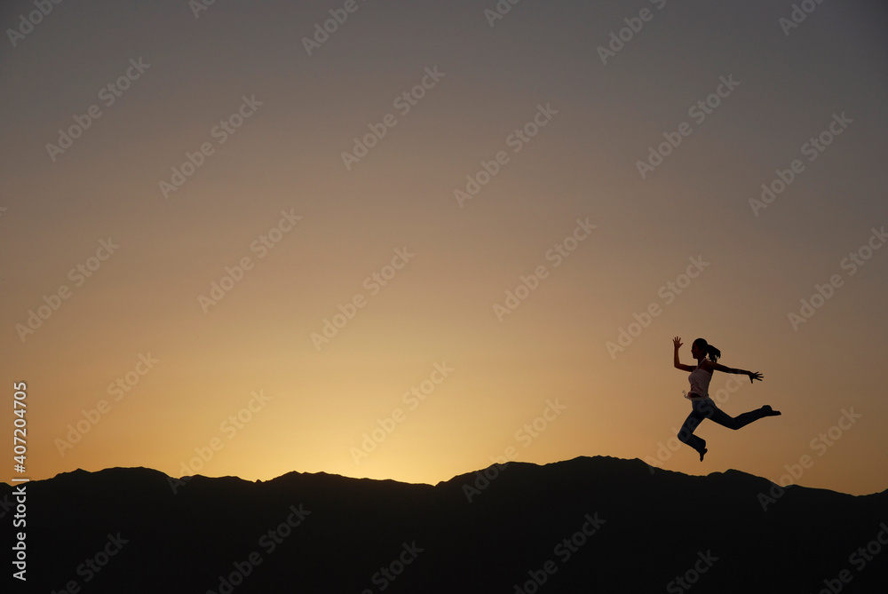 A woman is running silhouette