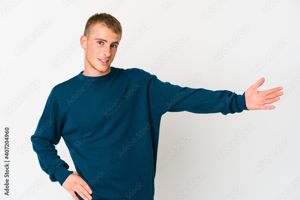 Young caucasian handsome man showing a welcome expression. Young caucasian handsome man showing a welcome expression.