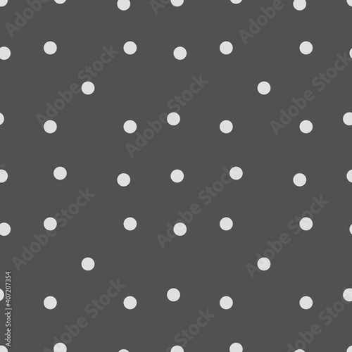 Seamless pattern of round dots on a dark gray background for textiles  pillows  bedspreads  bedding  wrapping paper.