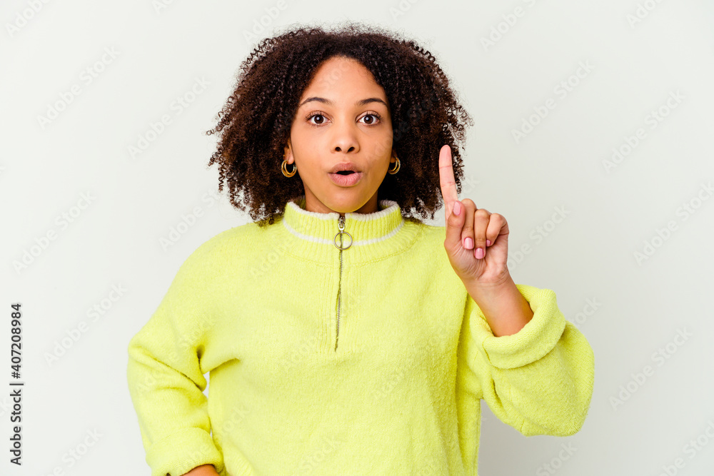 Young african american mixed race woman isolated pointing upside with opened mouth. Young african american mixed race woman isolated pointing upside with opened mouth.