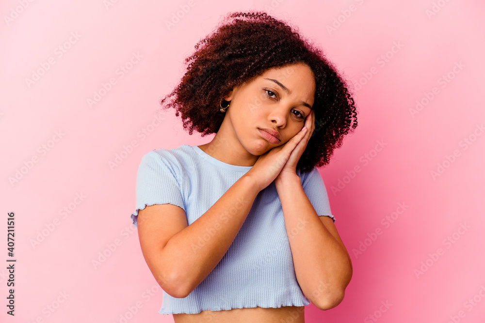 Young african american mixed race woman isolated yawning showing a tired gesture covering mouth with hand. Young african american mixed race woman isolated yawning showing a tired gesture covering mouth with hand.