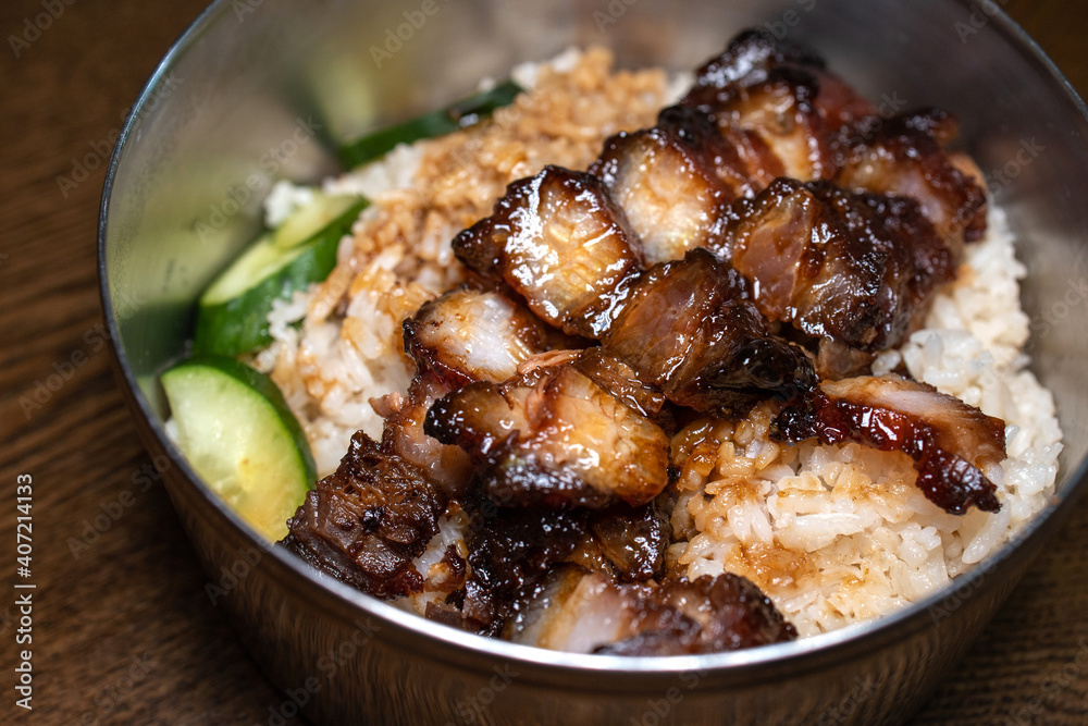 Chinese bbq sweet pork serve with a fried egg and white rice. Cantonese cuisine.
