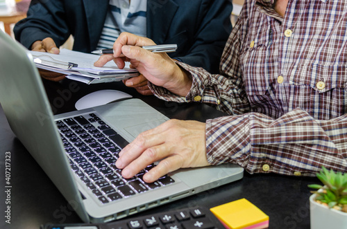 Meeting to review business documents and information on marketing and financial statements, reports and business planning.