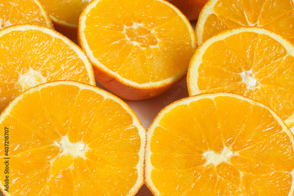 Close-up of orange pulps cut in half. Organic texture background.