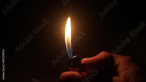 Igniting a cheap plastic gas lighter slow motion photo