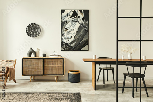 Stylish scandinavian living room interior of modern apartment with wooden commode, design table, chairs, carpet, abstract paintings on the wall and personal accessories in unique home decor. Template.