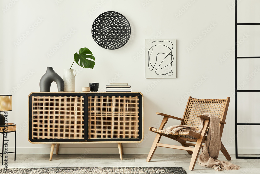 Φωτογραφία Stylish scandinavian living room interior of modern apartment with wooden commode, design armchair, carpet, leaf in vase, table lamp and personal accessories in unique home decor