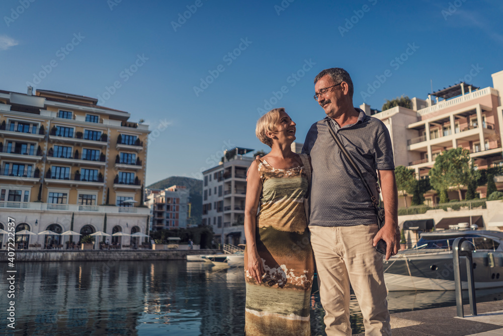 Beautiful older couple on vacation enjoying summer time and traveling